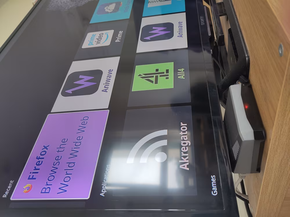 A Raspberry Pi 4 running KDE Plasma Bigscreen on a
          HD TV, firefox browser, aniwave and amazon prime are listed
          in the recent apps list